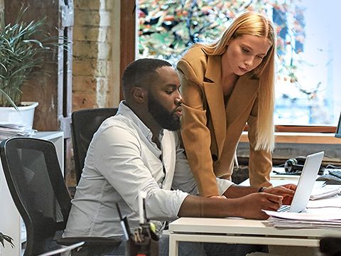 Man and woman in conversation in an office